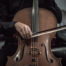man sitting at cello