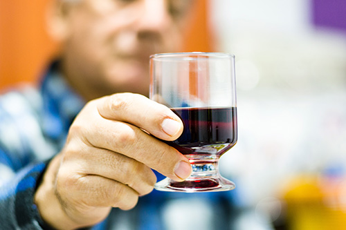 Man holding a glass of wine