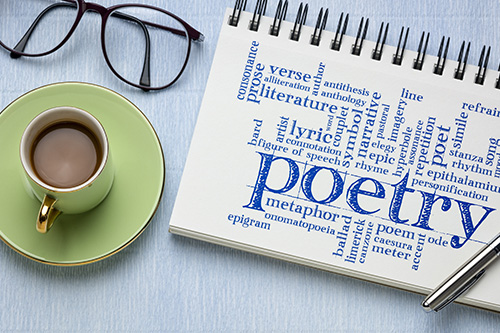 note pad with the word poetry written on it