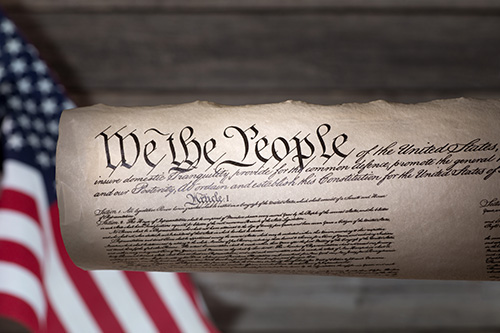 US Constitution Scroll of the U.S. Constitution Movie clapper board with St Peter cathedral view out of focus in background