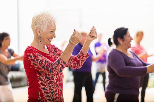older adults line dancing