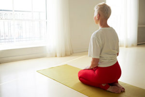 Posture-Yoga-300x200 Lady sitting on a yoga mat