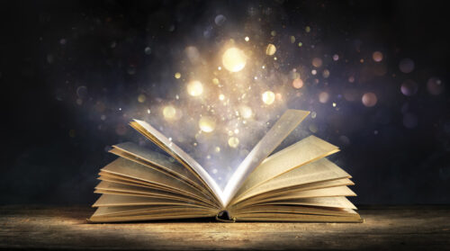 Magic Book With Lights Glowing In Black Background - Literature