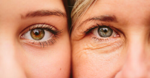 Close up on eyes of mother and daughter faces next to one another