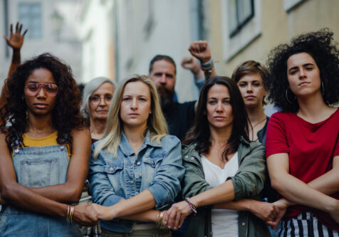 Group of people activists protesting on streets, women march and demonstration concept. Portrait of group of people activists protesting on streets, women march and demonstration concept.