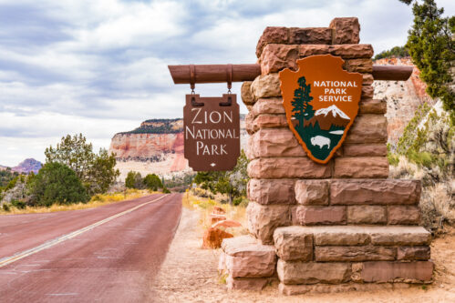 Zion National Park Entrance Sign SPRINGDALE, UTAH - OCTOBER 19, 2017: Entrance sign to Zion National Park in Springdale, Utah