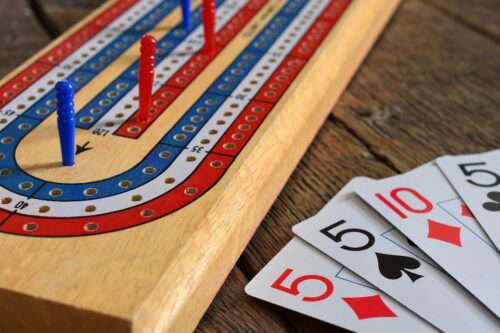 Cribbage board and playing cards