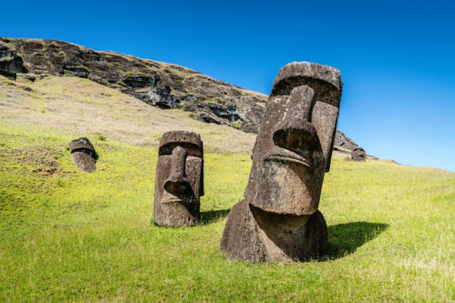 Easter Island Statues Rano Raraku Moais Rapa Nui Easter Island Moai Statues at Rano Raraku under sunny summer sky. Rano Raraku, Rapa Nui National Park, Hanga Roa, Easter Island, Chile.