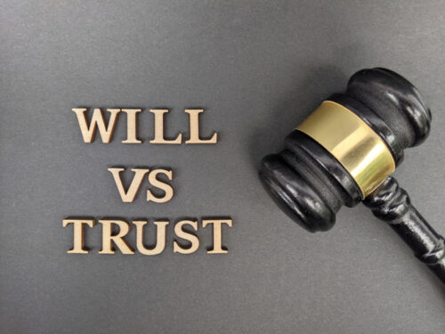 Legal comparison of estate planning tools by understanding the differences between wills and trusts for asset distribution. Will vs trust text with hand gavel at the side