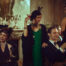 Stylish vintage friends toasting in a glamorous evening setting.